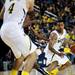Michigan sophomore Trey Burke looks to drive past Illinois defenders in the game on Sunday, Feb. 24. Burke had 26 points and eights assists. Daniel Brenner I AnnArbor.com